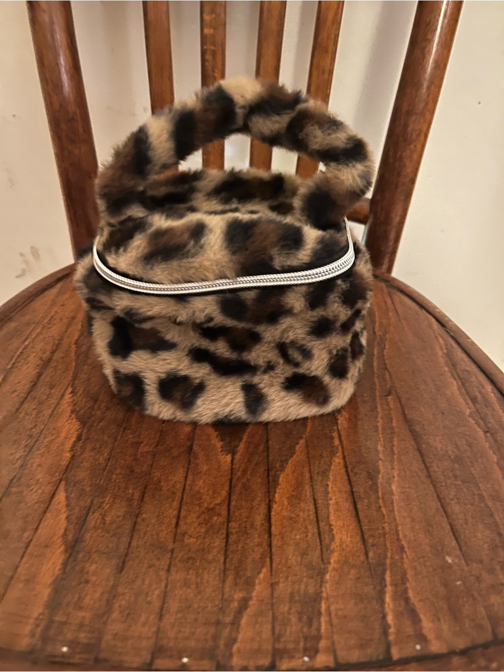 Urban Outfitters plush leopard cosmetic bag